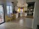 Bright kitchen featuring white cabinets, stainless appliances, and access to the backyard at 3164 Elmrock Pl, Las Vegas, NV 89121