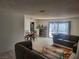 Spacious living area featuring modern decor, light-colored wood floors, and ample seating at 3164 Elmrock Pl, Las Vegas, NV 89121