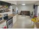 Bright living space connected to the kitchen with wood floors and comfortable seating at 3164 Elmrock Pl, Las Vegas, NV 89121
