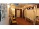 Cozy covered patio with outdoor seating, brick floor, and decorative lighting at 3164 Elmrock Pl, Las Vegas, NV 89121