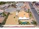 A bird's-eye view of a home with a backyard pool, boat parking, and a spacious lot with ample storage at 3165 S Monte Cristo Way, Las Vegas, NV 89117
