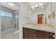 Beautiful bathroom with a walk-in shower, granite countertop, and updated vanity at 3165 S Monte Cristo Way, Las Vegas, NV 89117