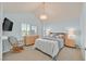 Comfortable bedroom with a rocking chair, dresser, and plush carpeting at 3165 S Monte Cristo Way, Las Vegas, NV 89117