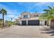 Charming two-story home with desert landscaping, brick driveway, and a three-car garage at 3165 S Monte Cristo Way, Las Vegas, NV 89117