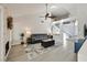 Bright living room with vaulted ceilings, modern flooring, and a cozy fireplace featuring a stone accent wall at 3165 S Monte Cristo Way, Las Vegas, NV 89117