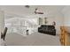 Upstairs loft area with a cozy couch, neutral carpet, and views of the main level below at 3165 S Monte Cristo Way, Las Vegas, NV 89117