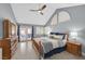 Relaxing bedroom with vaulted ceiling, wood-look floors, and access to outdoor seating at 3165 S Monte Cristo Way, Las Vegas, NV 89117