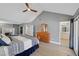 Bright bedroom featuring wood floors, walk in closet, fireplace and an ensuite bathroom at 3165 S Monte Cristo Way, Las Vegas, NV 89117
