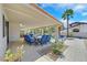 Relaxing outdoor patio with lounge seating and a view of the pool and palm trees at 3165 S Monte Cristo Way, Las Vegas, NV 89117