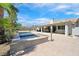 Backyard pool and spa with lush landscaping and a spacious patio at 3165 S Monte Cristo Way, Las Vegas, NV 89117