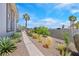 Desert landscaping and walkway enhance this inviting side yard at 3165 S Monte Cristo Way, Las Vegas, NV 89117