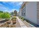 Walkway and manicured landscaping enhance the curb appeal of this home at 3165 S Monte Cristo Way, Las Vegas, NV 89117