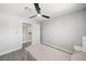 Neutrally decorated bedroom features wood-look flooring, ceiling fan, and closet at 3905 Casa Grande Ave, Las Vegas, NV 89102