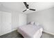 Bright bedroom with a ceiling fan, closet with white doors, and a cozy bed with plush pillows at 3905 Casa Grande Ave, Las Vegas, NV 89102