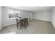 Open dining room with wood-look floors and direct access to the backyard pool at 3905 Casa Grande Ave, Las Vegas, NV 89102