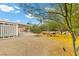 Large backyard with gravel, desert landscaping, covered patio, and outdoor seating area at 4185 W Arby Ave, Las Vegas, NV 89118
