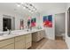 Bright bathroom featuring a double vanity with a granite countertop and tile floor at 4185 W Arby Ave, Las Vegas, NV 89118