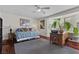 Cozy bedroom with hardwood floors, a ceiling fan, and plenty of natural light at 4185 W Arby Ave, Las Vegas, NV 89118
