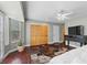 Bright and airy bedroom with hardwood floors, ample closet space, and a view of the yard at 4185 W Arby Ave, Las Vegas, NV 89118
