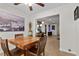Cozy dining room featuring modern decor, tile floors, and an adjacent living area at 4185 W Arby Ave, Las Vegas, NV 89118