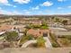Landscaped single-Gathering home with a charming driveway, mature trees, and desert foliage in a quiet neighborhood at 4185 W Arby Ave, Las Vegas, NV 89118