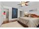Cozy main bedroom with hardwood floors, decorative art, and a walk-in bathroom at 4185 W Arby Ave, Las Vegas, NV 89118