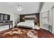 Main bedroom features hardwood floors, a ceiling fan, and a well-appointed design at 4185 W Arby Ave, Las Vegas, NV 89118