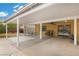 Covered patio with ample space for seating and views of the backyard landscaping at 4185 W Arby Ave, Las Vegas, NV 89118