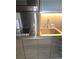Close-up of a sleek stainless steel kitchenette with modern appliances and a minimalist design at 4381 W Flamingo Rd # 3109, Las Vegas, NV 89103