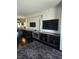 Spacious living room featuring a large flat screen tv and plenty of shelving space at 4381 W Flamingo Rd # 3109, Las Vegas, NV 89103