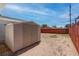 Wide backyard view with storage shed and wood fence in residential neighborhood at 4432 Ash Ave, Las Vegas, NV 89110
