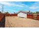 Spacious backyard with a wood fence, ready for landscaping and outdoor activities at 4432 Ash Ave, Las Vegas, NV 89110