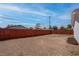 A spacious backyard with wood fence and landscaping potential at 4432 Ash Ave, Las Vegas, NV 89110