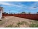 Wood fence borders the edge of the grass and gravel backyard at 4432 Ash Ave, Las Vegas, NV 89110