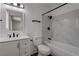 Modern bathroom with sleek white vanity, black hardware, and tiled shower at 4432 Ash Ave, Las Vegas, NV 89110