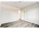 Bright bedroom featuring new gray laminate flooring and white paint at 4432 Ash Ave, Las Vegas, NV 89110