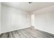 Bright bedroom featuring new gray laminate flooring and white paint at 4432 Ash Ave, Las Vegas, NV 89110