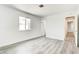 Bright bedroom featuring new gray laminate flooring and white paint at 4432 Ash Ave, Las Vegas, NV 89110