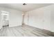 Bright bedroom with ensuite bathroom boasts modern gray wood floors at 4432 Ash Ave, Las Vegas, NV 89110