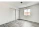 Bedroom with large closet and new gray laminate flooring at 4432 Ash Ave, Las Vegas, NV 89110
