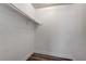 Walk-in closet offers fresh white paint, wood-look flooring, and ample storage with a rod at 4432 Ash Ave, Las Vegas, NV 89110
