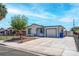 A charming single-story house with an attached garage and a well-kept front yard with a chain-link fence at 4432 Ash Ave, Las Vegas, NV 89110