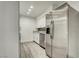 Bright kitchen features stainless steel appliances, stone countertops, and light, modern cabinetry at 4432 Ash Ave, Las Vegas, NV 89110