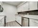 Stylish kitchen showcases stainless steel appliances, stone countertops and white cabinets at 4432 Ash Ave, Las Vegas, NV 89110