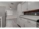 Open kitchen featuring white cabinets, stainless steel appliances, and modern countertops at 4432 Ash Ave, Las Vegas, NV 89110