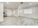 An open-concept space boasting sleek, light-colored flooring, fresh paint, and modern recessed lighting at 4432 Ash Ave, Las Vegas, NV 89110