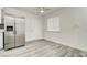 Bright living space with stainless steel refrigerator and a dining area at 4432 Ash Ave, Las Vegas, NV 89110