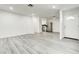 An open-concept space featuring sleek flooring, fresh paint, stainless steel appliances, and recessed lighting at 4432 Ash Ave, Las Vegas, NV 89110