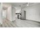 Open-concept living space flows into a kitchen with stainless steel appliances at 4432 Ash Ave, Las Vegas, NV 89110