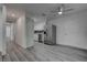 Spacious living area with updated kitchen, stainless steel appliances, and ample natural light at 4432 Ash Ave, Las Vegas, NV 89110